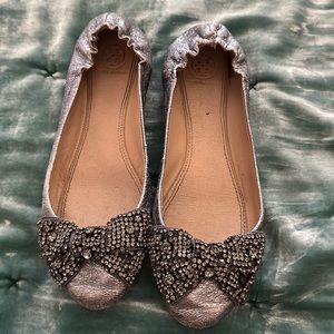 Silver Tory Burch ballet flats. Loved condition. Missing rhinestone on left shoe